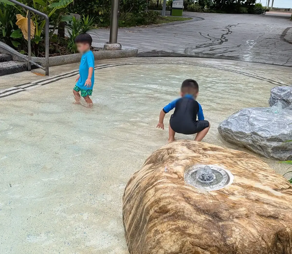 Sand-and-water play beside the sea at Coastal PlayGrove, East Coast Park.