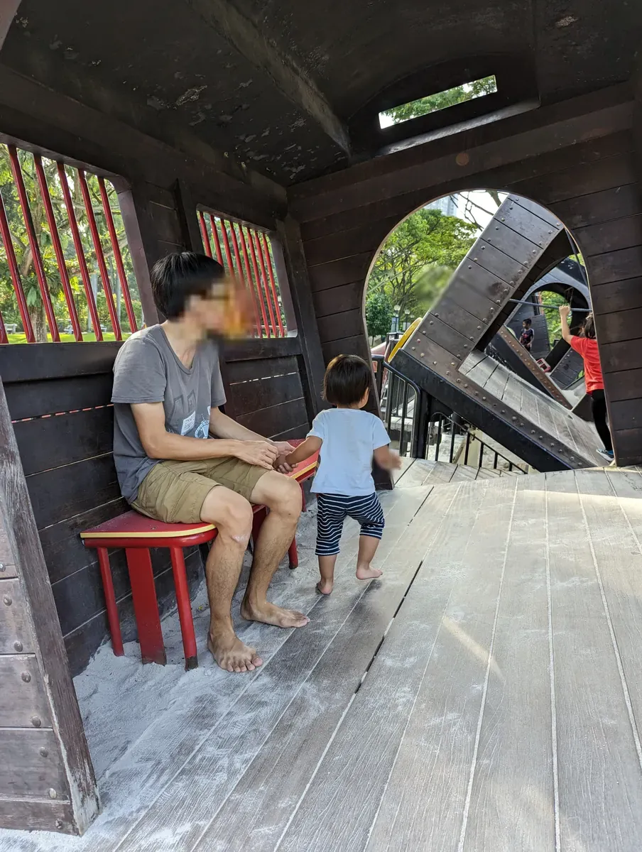Inside the train-carriage play structure at Tiong Bahru Park.